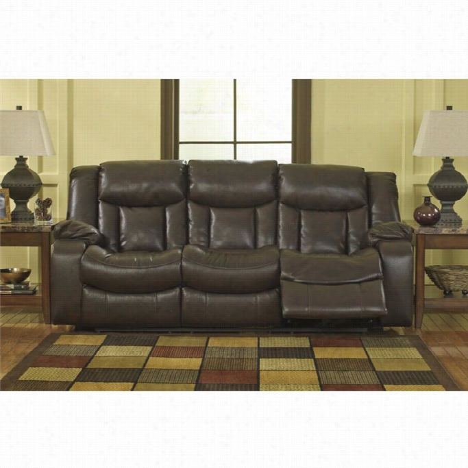 Ashley Carnell Faux Leather Reclining Sofa In Bron