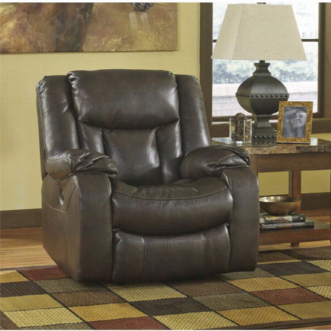 Ashley Carnell Faux Leathrr Rocker Recliner In Brown