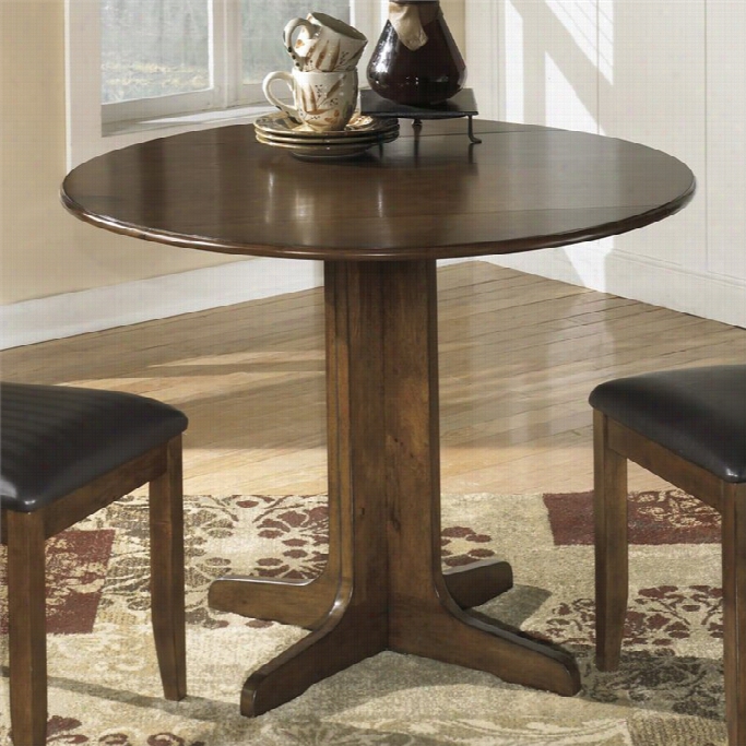 Ashley Stuman Roujd Wood Dining Table In Brown