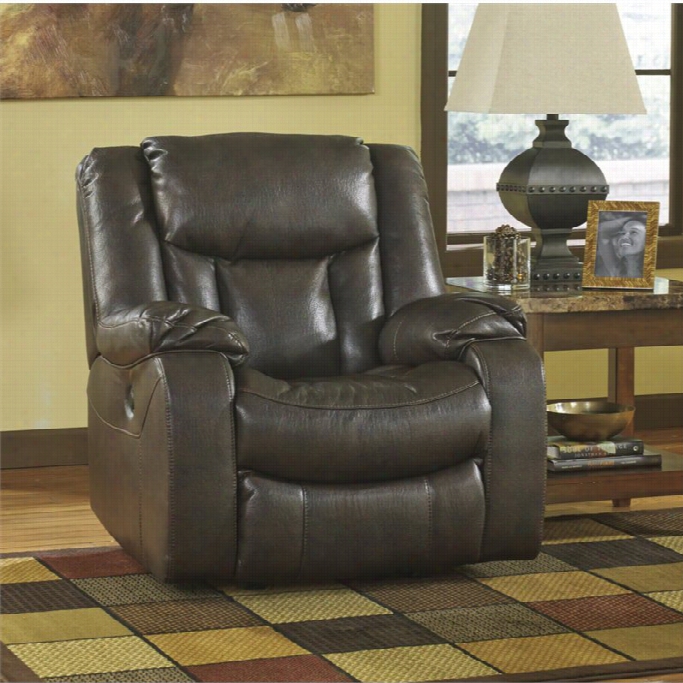 Ashley Carnell Faux Leather Power Rocer Recliner In Brown