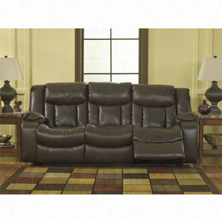 Ashley Carnell Faux Leather Leaning Power Sofa In Brpwn